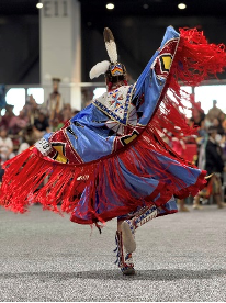 Hunting Moon Pow Wow dancer in vibrant costume